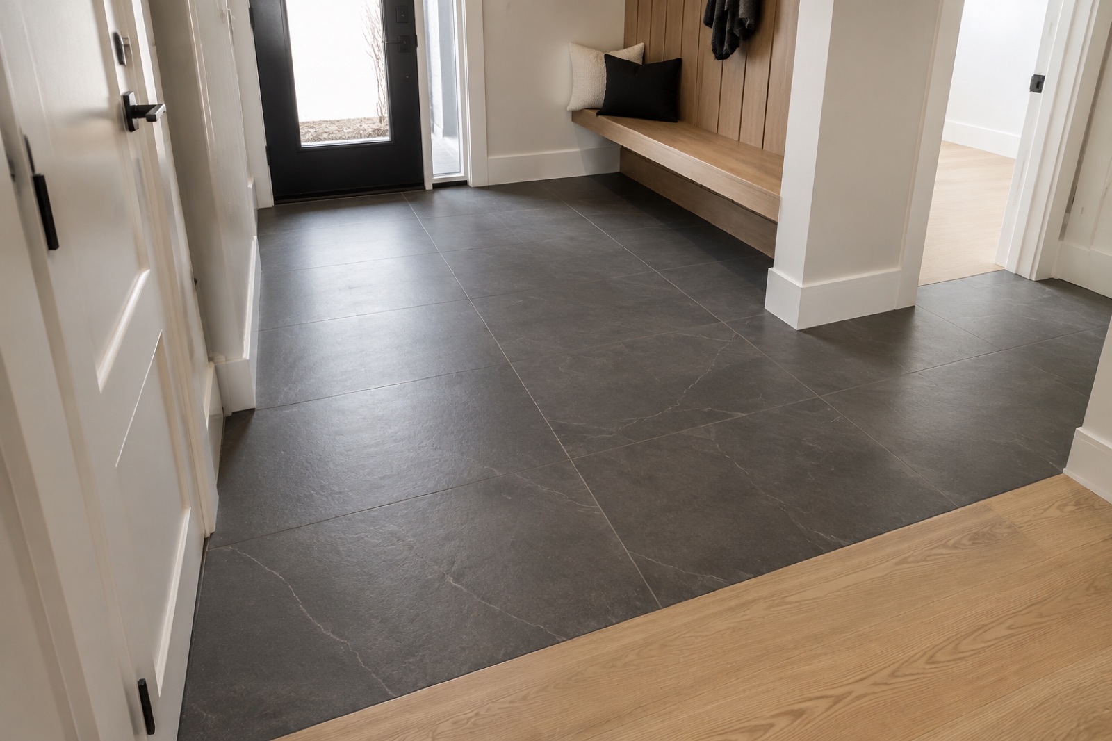Concept visualization of an Aurora entry floor with charcoal stone-look porcelain tile