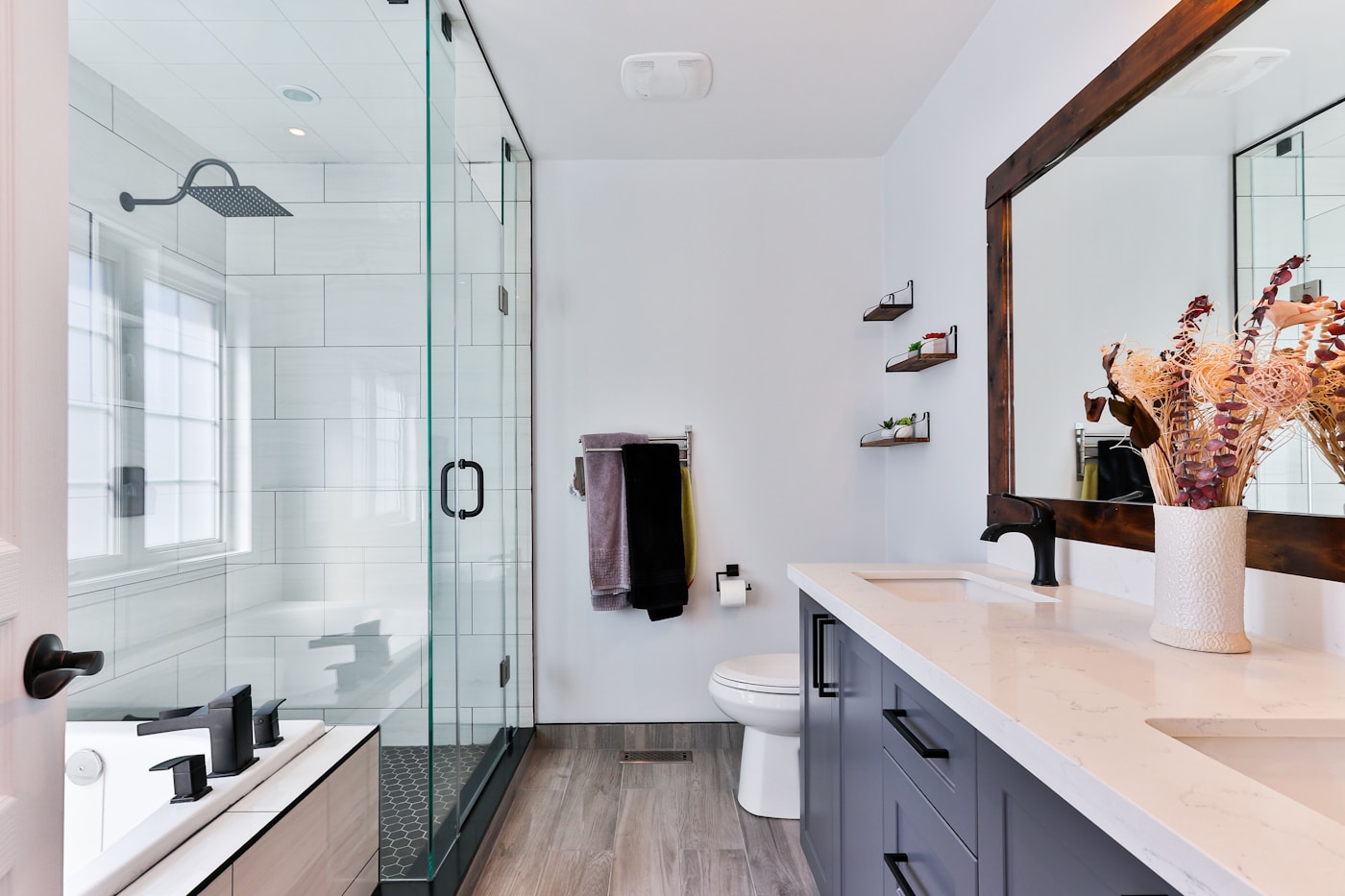 Bathroom with porcelain walls and a tiled shower